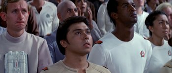 Movie still from “Star Trek: The Motion Picture” (1979), directed by Robert Wise – A group of people standing in front of each other; Close Up shot, Low angle