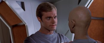 Movie still from “Star Trek: The Motion Picture” (1979), directed by Robert Wise – A person wearing a shirt; Close Up shot, Over the shoulder angle