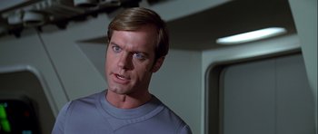 Movie still from “Star Trek: The Motion Picture” (1979), directed by Robert Wise – A man that is looking at the camera; Close Up shot, Over the shoulder angle