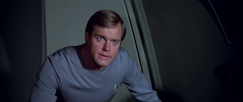 Movie still from “Star Trek: The Motion Picture” (1979), directed by Robert Wise – A person wearing a shirt; Close Up shot, Over the shoulder angle