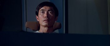 Movie still from “Star Trek: The Motion Picture” (1979), directed by Robert Wise – A man sitting in front of a computer looking up; Close Up shot, Low angle