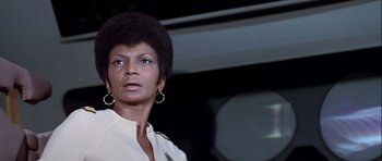 Movie still from “Star Trek: The Motion Picture” (1979), directed by Robert Wise – An older woman with big hair looking into the distance; Close Up shot, Low angle