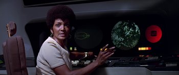 Movie still from “Star Trek: The Motion Picture” (1979), directed by Robert Wise – A woman is standing in front of a control panel; Medium shot, Low angle