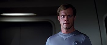 Movie still from “Star Trek: The Motion Picture” (1979), directed by Robert Wise – A person wearing a shirt; Close Up shot, Over the shoulder angle
