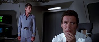 Movie still from “Star Trek: The Motion Picture” (1979), directed by Robert Wise – A man in a uniform and a woman in a uniform; Medium shot, Over the shoulder angle