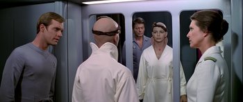 Movie still from “Star Trek: The Motion Picture” (1979), directed by Robert Wise – A man and a woman are looking in the mirror; Medium shot, Over the shoulder angle