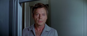 Movie still from “Star Trek: The Motion Picture” (1979), directed by Robert Wise – A person wearing a blue shirt; Close Up shot, Low angle