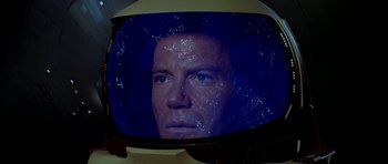 Movie still from “Star Trek: The Motion Picture” (1979), directed by Robert Wise – A man is seen through a television screen; Close Up shot, High angle