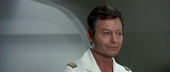 Movie still from “Star Trek: The Motion Picture” (1979), directed by Robert Wise – A person wearing a uniform; Close Up shot, Over the shoulder angle