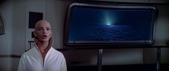 Movie still from “Star Trek: The Motion Picture” (1979), directed by Robert Wise – A man standing in front of a screen with a picture on it; Medium shot, Low angle