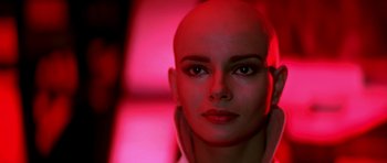 Movie still from “Star Trek: The Motion Picture” (1979), directed by Robert Wise – A woman's face is lit up by a red light; Close Up shot, Low angle