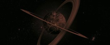 Movie still from “Superman Returns” (2006), directed by Bryan Singer – An image of an image of a planet in space; Extreme Wide shot, Overhead angle