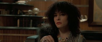 Movie still from “Superman Returns” (2006), directed by Bryan Singer – A woman holding a fur ball in a room; Close Up shot, Over the shoulder angle