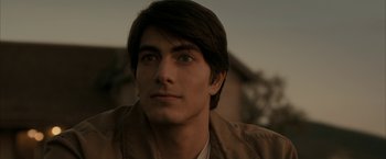 Movie still from “Superman Returns” (2006), directed by Bryan Singer – A person wearing a jacket; Close Up shot, Over the shoulder angle