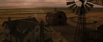 Movie still from “Superman Returns” (2006), directed by Bryan Singer – An aerial view of an old barn and a farm house; Extreme Wide shot, High angle
