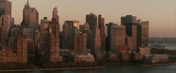 Movie still from “Superman Returns” (2006), directed by Bryan Singer – A view of a city skyline at sunset; Extreme Wide shot, High angle