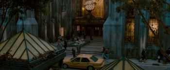 Movie still from “Superman Returns” (2006), directed by Bryan Singer – A yellow taxi cab driving down a street; Extreme Wide shot, High angle