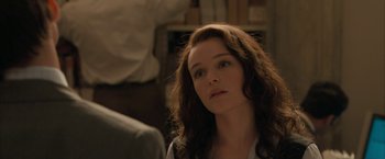 Movie still from “Superman Returns” (2006), directed by Bryan Singer – A person with long brown hair; Close Up shot, Over the shoulder angle