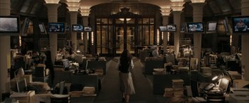 Movie still from “Superman Returns” (2006), directed by Bryan Singer – A woman walking through a lobby of an office building at night; Wide shot, High angle
