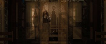 Movie still from “Superman Returns” (2006), directed by Bryan Singer – A woman standing in front of an ornate building; Wide shot, Low angle