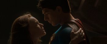 Movie still from “Superman Returns” (2006), directed by Bryan Singer – A man and a woman standing next to each other in the dark; Close Up shot, Low angle