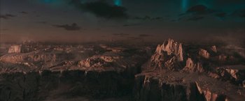 Movie still from “Superman Returns” (2006), directed by Bryan Singer – An aerial view of a rocky area at night; Extreme Wide shot, High angle