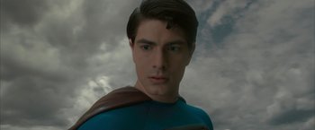 Movie still from “Superman Returns” (2006), directed by Bryan Singer – A person wearing a blue shirt; Close Up shot, Low angle