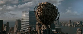 Movie still from “Superman Returns” (2006), directed by Bryan Singer – An image of a globe in the middle of a city; Extreme Wide shot, High angle