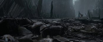 Movie still from “Superman Returns” (2006), directed by Bryan Singer – A large amount of rocks in the middle of a field; Extreme Wide shot, High angle