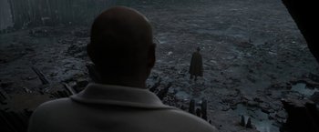 Movie still from “Superman Returns” (2006), directed by Bryan Singer – A man standing in the middle of the ocean looking at another man; Extreme Wide shot, Over the shoulder angle