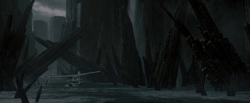 Movie still from “Superman Returns” (2006), directed by Bryan Singer – An airplane is flying through a dark forest; Extreme Wide shot, High angle