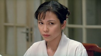 Movie still from “Eat Drink Man Woman” (1994), directed by Ang Lee – A person wearing a white shirt; Close Up shot, Over the shoulder angle