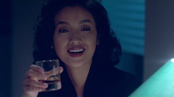 Movie still from “Eat Drink Man Woman” (1994), directed by Ang Lee – A woman is holding a glass of water; Close Up shot, Over the shoulder angle