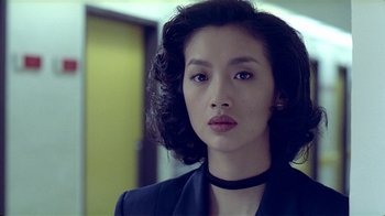 Movie still from “Eat Drink Man Woman” (1994), directed by Ang Lee – A person wearing a suit; Close Up shot, Over the shoulder angle