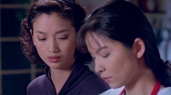 Movie still from “Eat Drink Man Woman” (1994), directed by Ang Lee – Two asian women sitting next to each other; Close Up shot, Over the shoulder angle