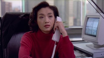 Movie still from “Eat Drink Man Woman” (1994), directed by Ang Lee – A woman holding a phone up to her ear; Close Up shot, High angle