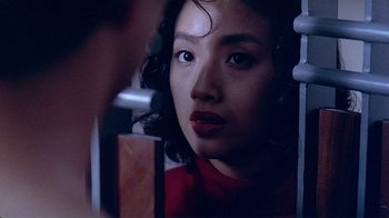 Movie still from “Eat Drink Man Woman” (1994), directed by Ang Lee – A person looking at a mirror; Close Up shot, Over the shoulder angle