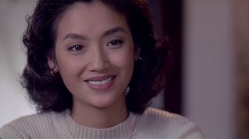 Movie still from “Eat Drink Man Woman” (1994), directed by Ang Lee – A person wearing a white sweater; Close Up shot, Over the shoulder angle