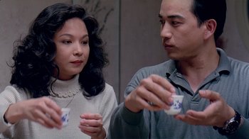 Movie still from “Eat Drink Man Woman” (1994), directed by Ang Lee – A man and a woman are looking at each other; Close Up shot, Over the shoulder angle