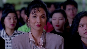 Movie still from “Eat Drink Man Woman” (1994), directed by Ang Lee – A person wearing a suit and tie; Close Up shot, Over the shoulder angle