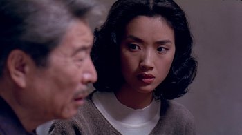 Movie still from “Eat Drink Man Woman” (1994), directed by Ang Lee – An older man and a young woman are looking at each other; Close Up shot, Over the shoulder angle