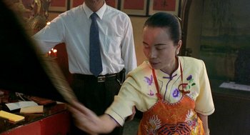 Movie still from “Rebels of the Neon God” (1992), directed by Tsai Ming-liang – A man and a woman are dancing in a restaurant; Medium shot, Over the shoulder angle