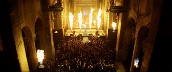 Movie still from “xXx” (2002), directed by Rob Cohen – A crowd of people in front of a stage with lights; Extreme Wide shot, High angle