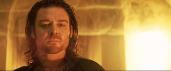 Movie still from “xXx” (2002), directed by Rob Cohen – A person with long brown hair; Close Up shot, Low angle