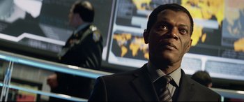Movie still from “xXx” (2002), directed by Rob Cohen – A man in a suit and tie; Close Up shot, Low angle