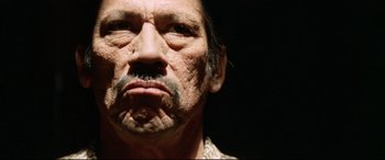 Movie still from “xXx” (2002), directed by Rob Cohen – An old man with a beard and a mustache; Close Up shot, Low angle