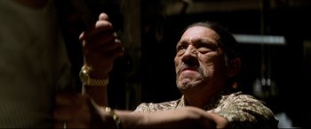 Movie still from “xXx” (2002), directed by Rob Cohen – An old man with a mustache and a mustache comb; Close Up shot, Low angle
