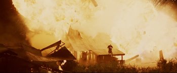 Movie still from “xXx” (2002), directed by Rob Cohen – Smoke billows out of a house on fire; Extreme Wide shot, Low angle