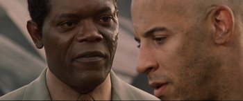 Movie still from “xXx” (2002), directed by Rob Cohen – A man and another man are looking at each other; Close Up shot, Over the shoulder angle