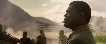 Movie still from “xXx” (2002), directed by Rob Cohen – A group of men standing next to each other on top of a hill; Close Up shot, Over the shoulder angle